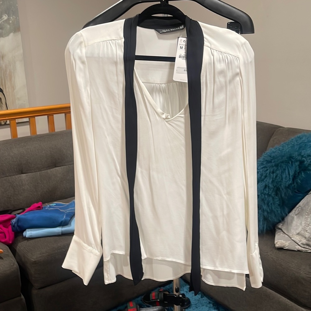 White blouse with black strings